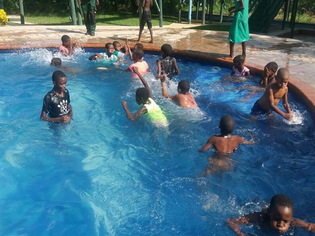 Children enjoying XMAS Party at Tamaindi Lodges <br> FUNDED BY C&C